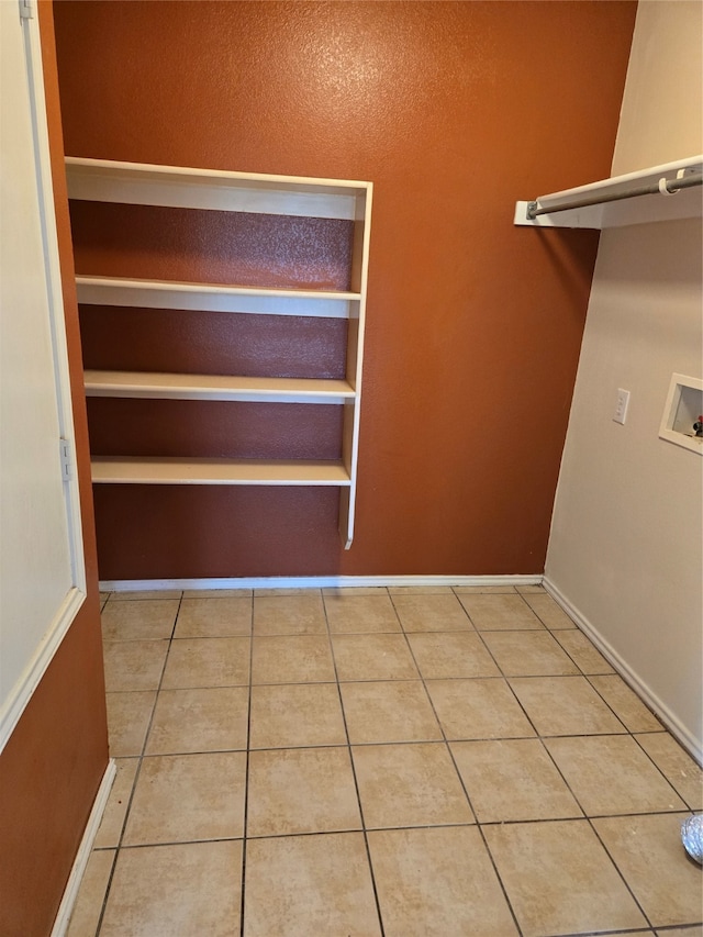 spacious closet with light tile patterned flooring