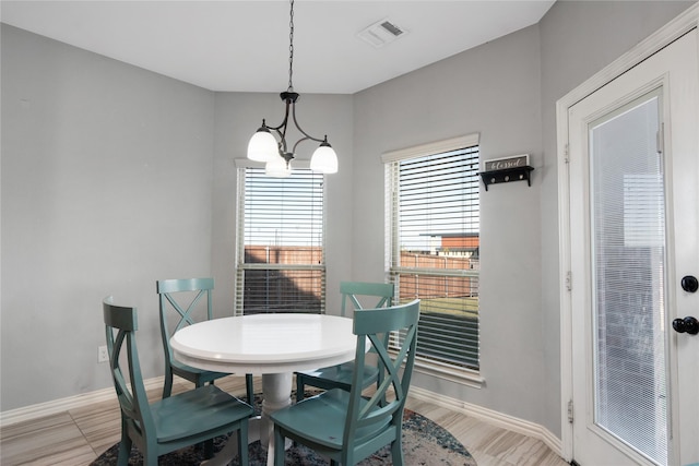 dining space featuring a chandelier