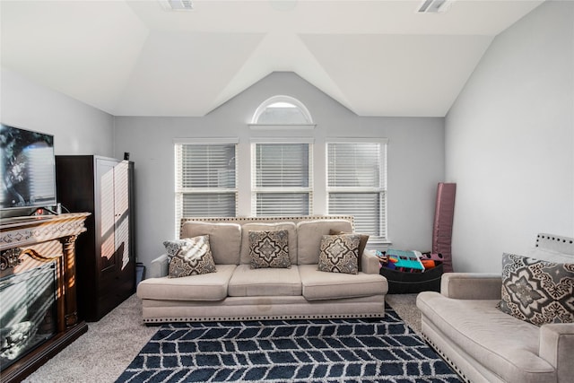 living room featuring carpet and lofted ceiling