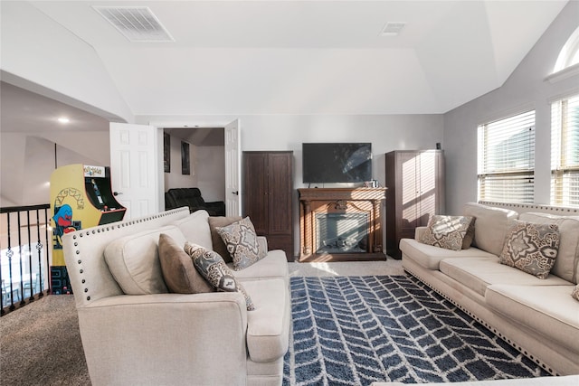 carpeted living room with vaulted ceiling