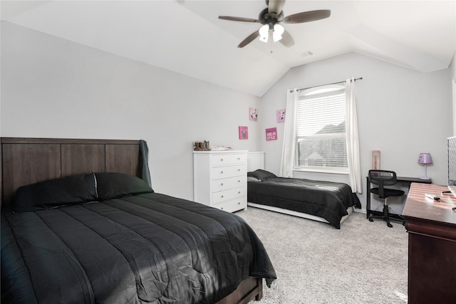 bedroom with ceiling fan, light carpet, and vaulted ceiling