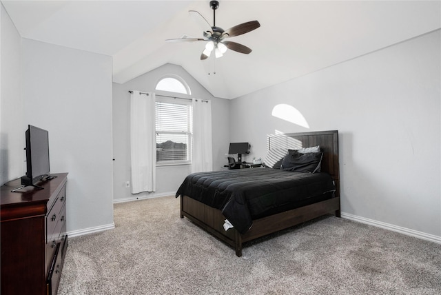 carpeted bedroom with ceiling fan and lofted ceiling