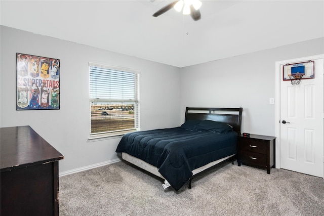 bedroom featuring ceiling fan and light colored carpet