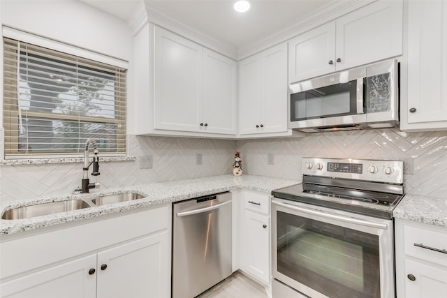 kitchen featuring white cabinetry, sink, and appliances with stainless steel finishes