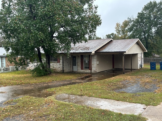 view of front facade with a carport