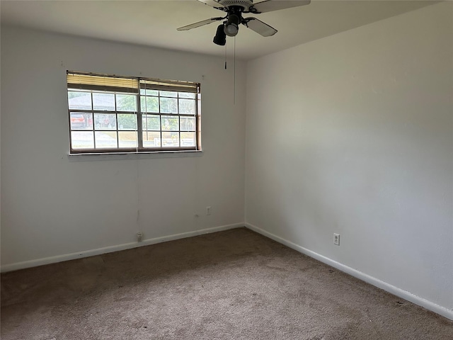 unfurnished room with carpet flooring and ceiling fan