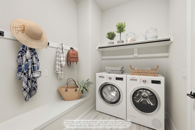 washroom featuring washer and dryer