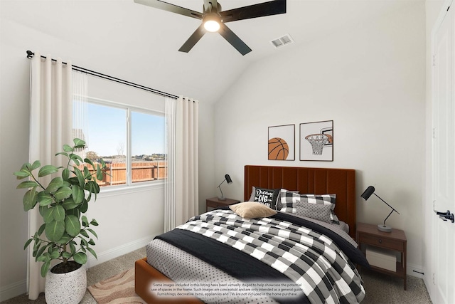 carpeted bedroom with vaulted ceiling and ceiling fan