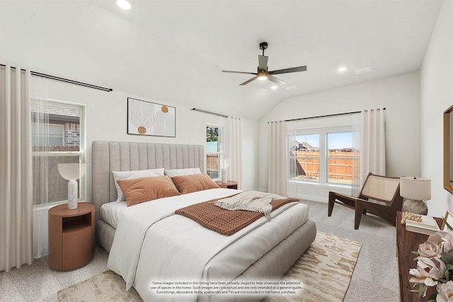 bedroom with ceiling fan, light carpet, and lofted ceiling