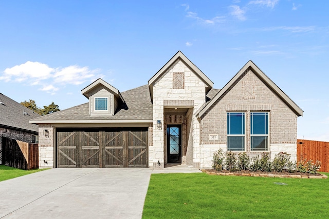 view of front facade featuring a front yard and a garage