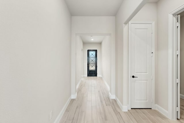 corridor featuring light hardwood / wood-style flooring