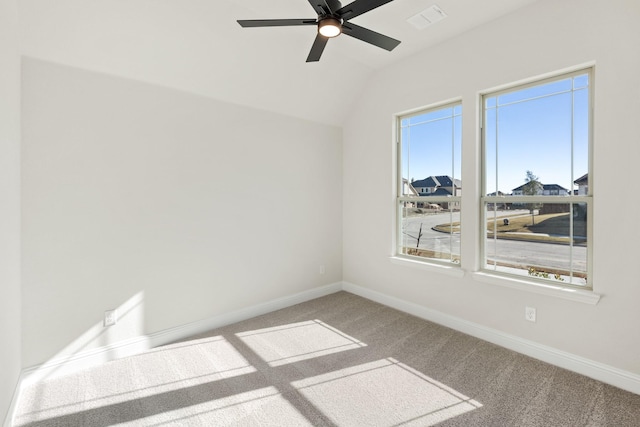 carpeted empty room featuring ceiling fan and lofted ceiling