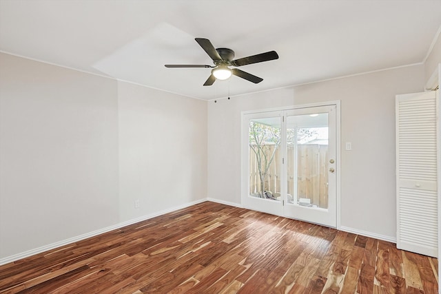 spare room featuring ceiling fan and wood-type flooring