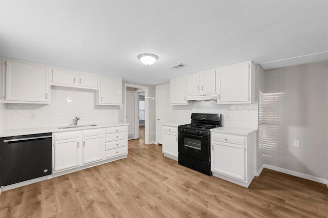 kitchen with white cabinetry, sink, black appliances, and light wood-type flooring