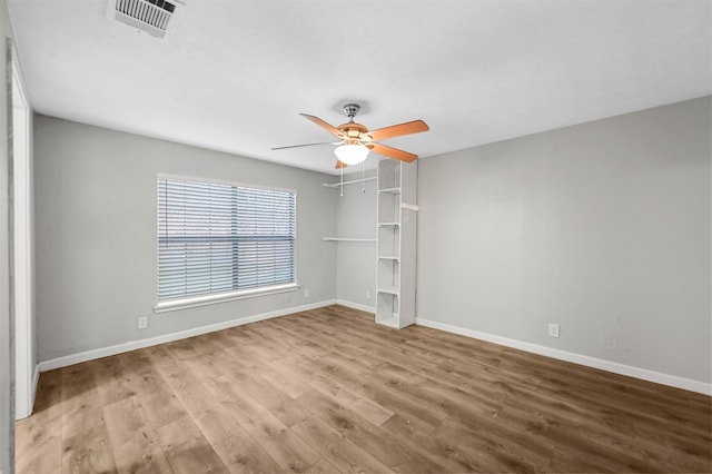 unfurnished room with ceiling fan and light hardwood / wood-style floors