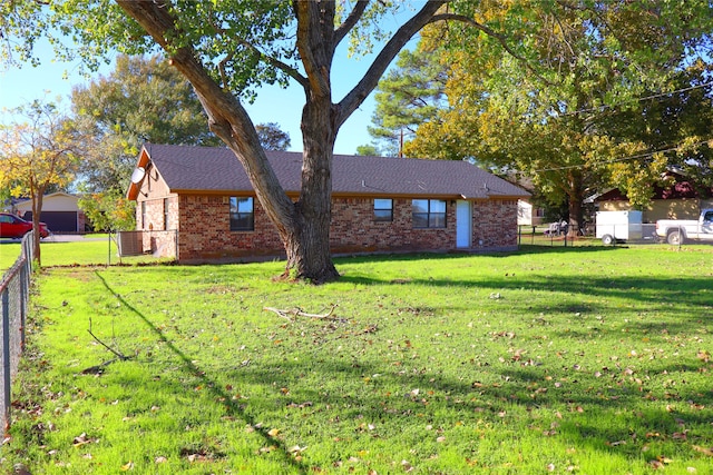 exterior space with a front yard and central air condition unit