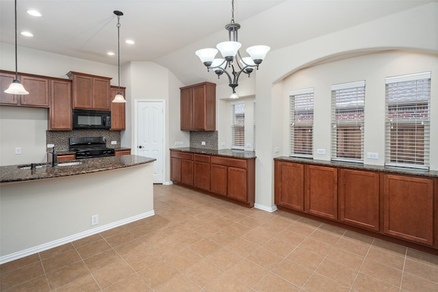 kitchen with sink, hanging light fixtures, dark stone counters, and black appliances