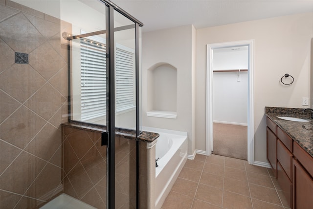 bathroom with vanity, separate shower and tub, and tile patterned floors