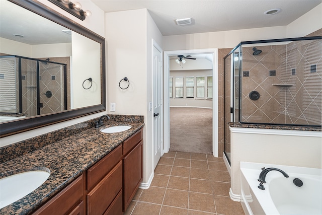 bathroom featuring tile patterned flooring, shower with separate bathtub, vanity, and ceiling fan