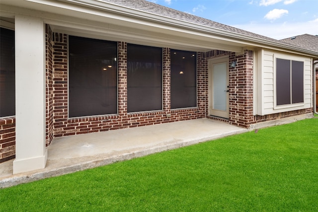 property entrance with a yard