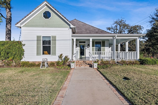 view of front of property featuring covered porch and a front yard