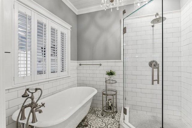 bathroom featuring independent shower and bath, crown molding, tile patterned flooring, and tile walls