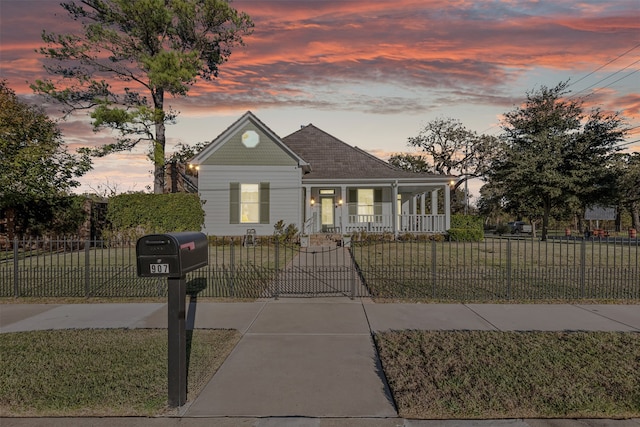 view of front of home featuring a yard and covered porch