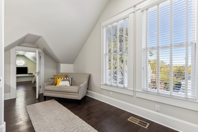 sitting room with dark hardwood / wood-style floors and lofted ceiling