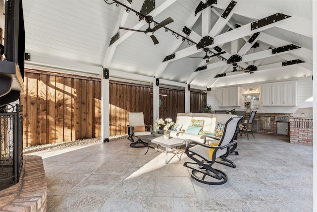 view of patio / terrace featuring a gazebo, an outdoor kitchen, and ceiling fan