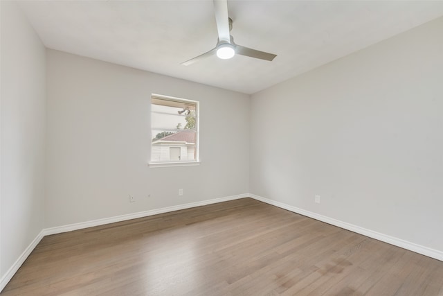 unfurnished room with ceiling fan and light wood-type flooring