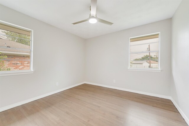 unfurnished room with light hardwood / wood-style flooring and ceiling fan