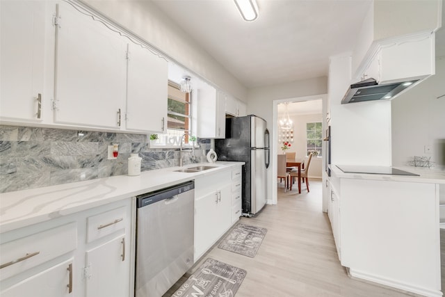 kitchen featuring sink, light hardwood / wood-style flooring, tasteful backsplash, white cabinetry, and stainless steel appliances