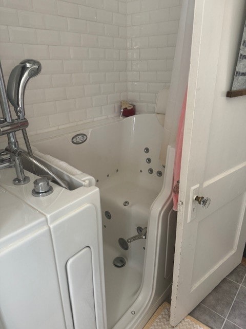 bathroom featuring a bathtub and tile patterned floors