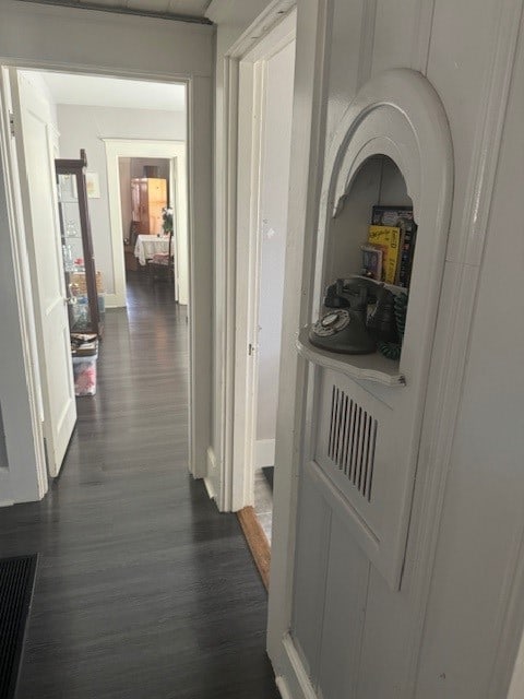 corridor with dark wood-type flooring