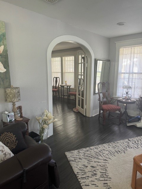 living room with dark hardwood / wood-style floors