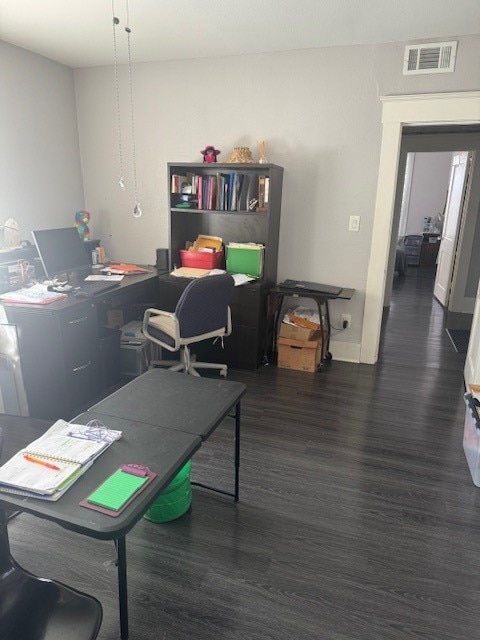 office space featuring dark wood-type flooring