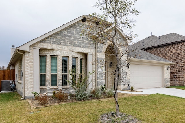 view of front facade featuring a garage, central AC, and a front yard