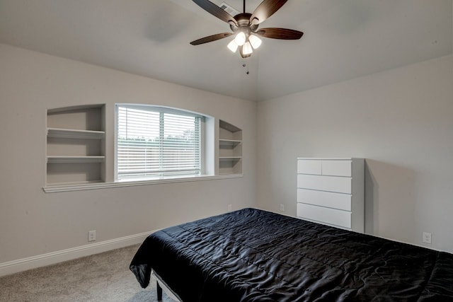 bedroom featuring ceiling fan, light colored carpet, and lofted ceiling