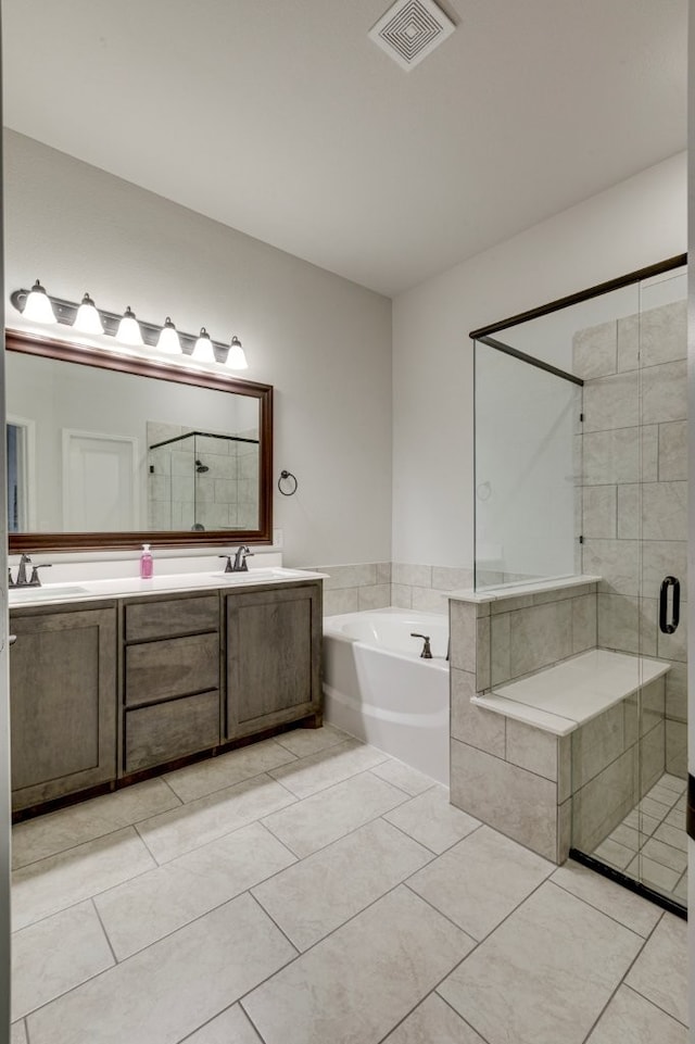 bathroom with vanity, tile patterned flooring, and independent shower and bath