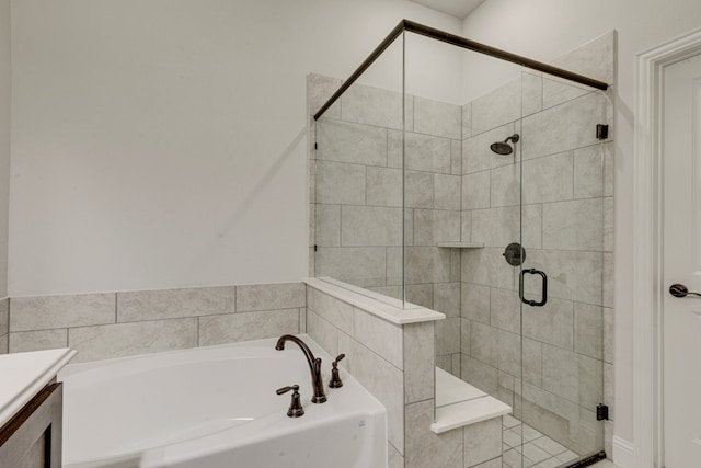 bathroom with vanity and plus walk in shower