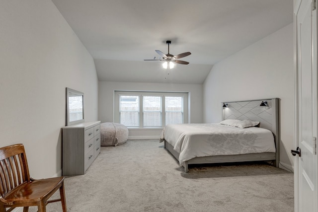 bedroom with lofted ceiling, light colored carpet, and ceiling fan