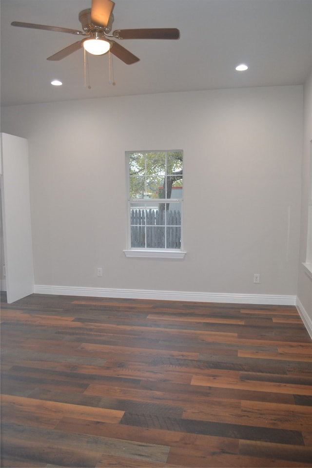 unfurnished room featuring dark hardwood / wood-style floors and ceiling fan