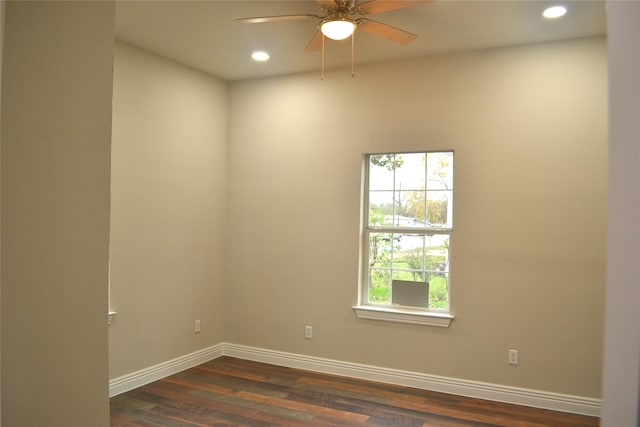 unfurnished room featuring ceiling fan and dark hardwood / wood-style flooring