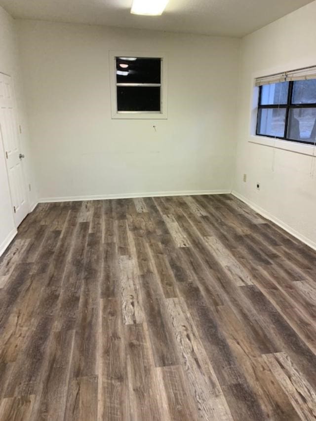 unfurnished room featuring dark hardwood / wood-style floors