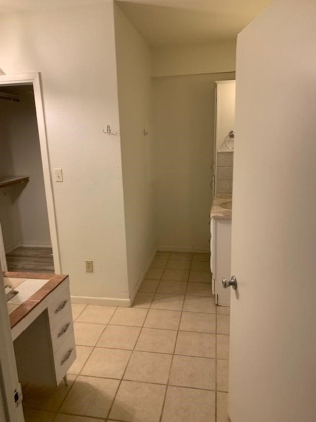 bathroom featuring tile patterned floors and vanity