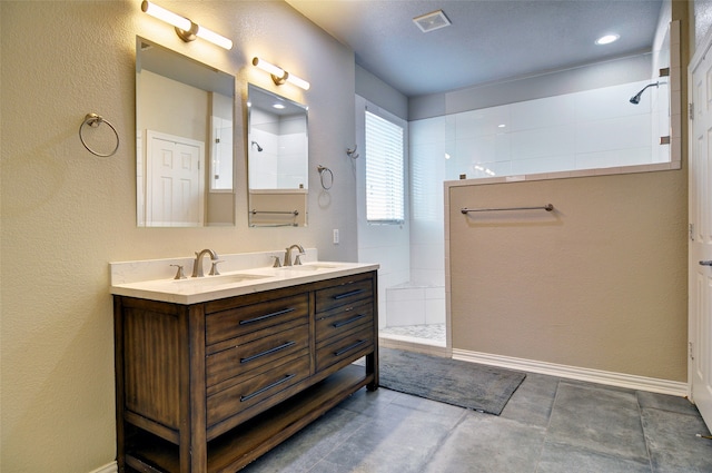 bathroom featuring vanity and a shower