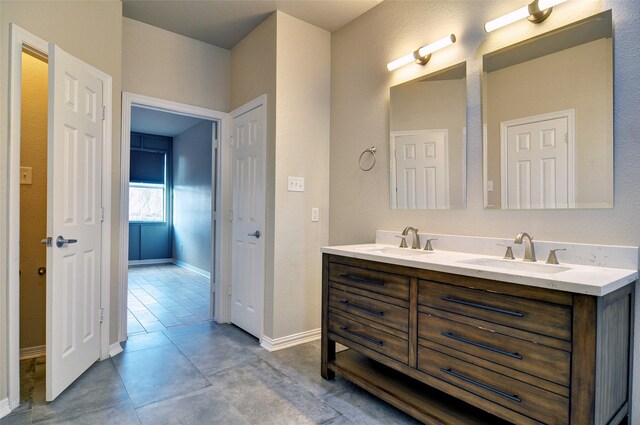 bathroom with tile patterned flooring and vanity