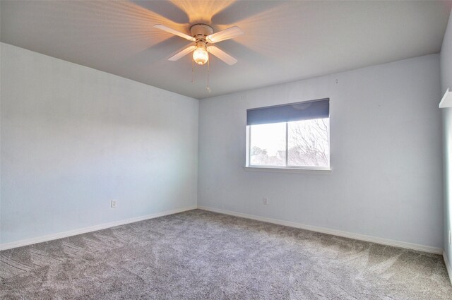 empty room with carpet flooring and ceiling fan