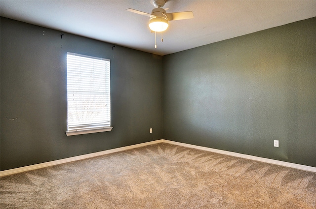 empty room featuring carpet and ceiling fan