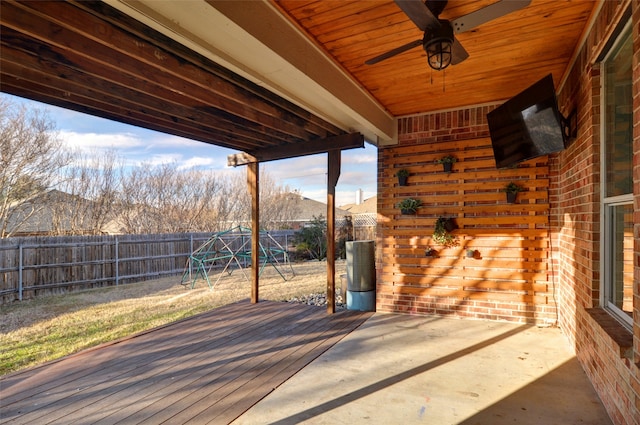 view of patio / terrace with a playground, a deck, and ceiling fan